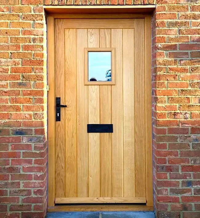 A wooden door with a lock.